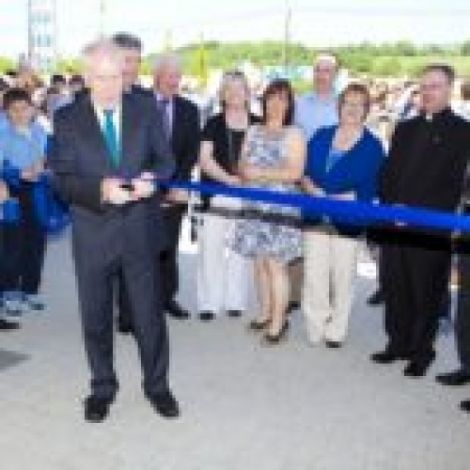 Minister Jimmy Deenihan cutting the ribbon at the opening of our new school building in June 2012.